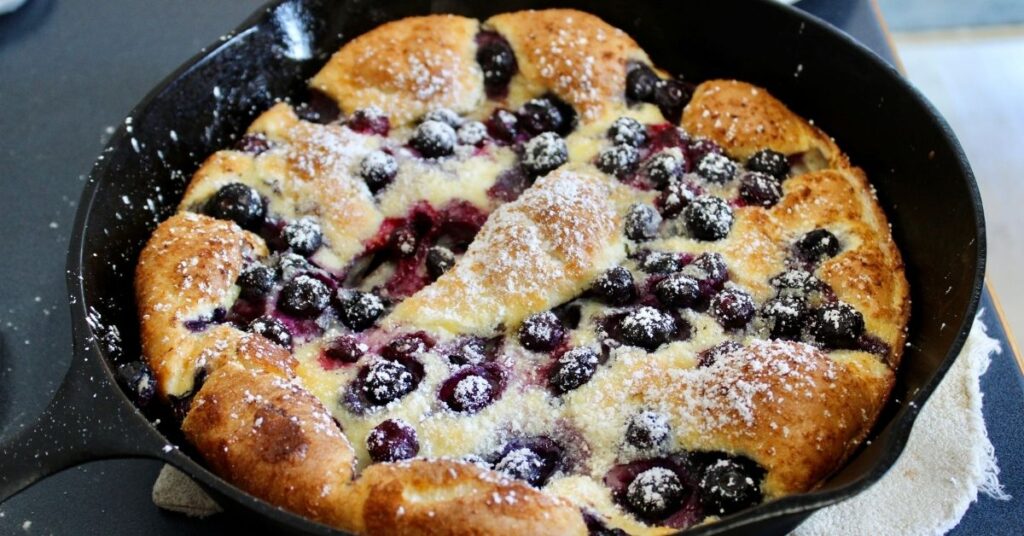 Blueberry Dutch baby with powdered sugar